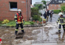 D: Schlamm und Wasser auf der Straße in Werne